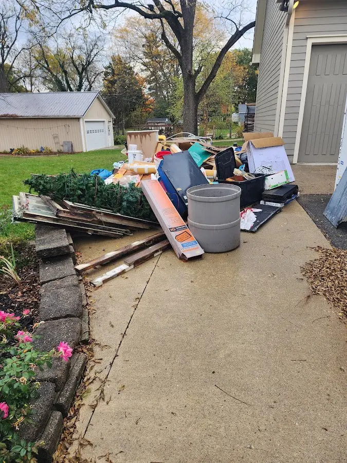 Dumpster being loaded with debris for 3 Yard Dumpster Rental in Arkwright